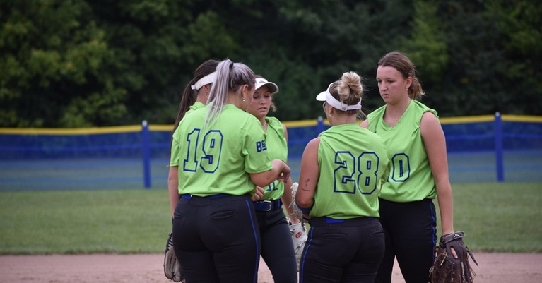 Members of Bryant & Stratton's softball team huddle up during team scrimmage.